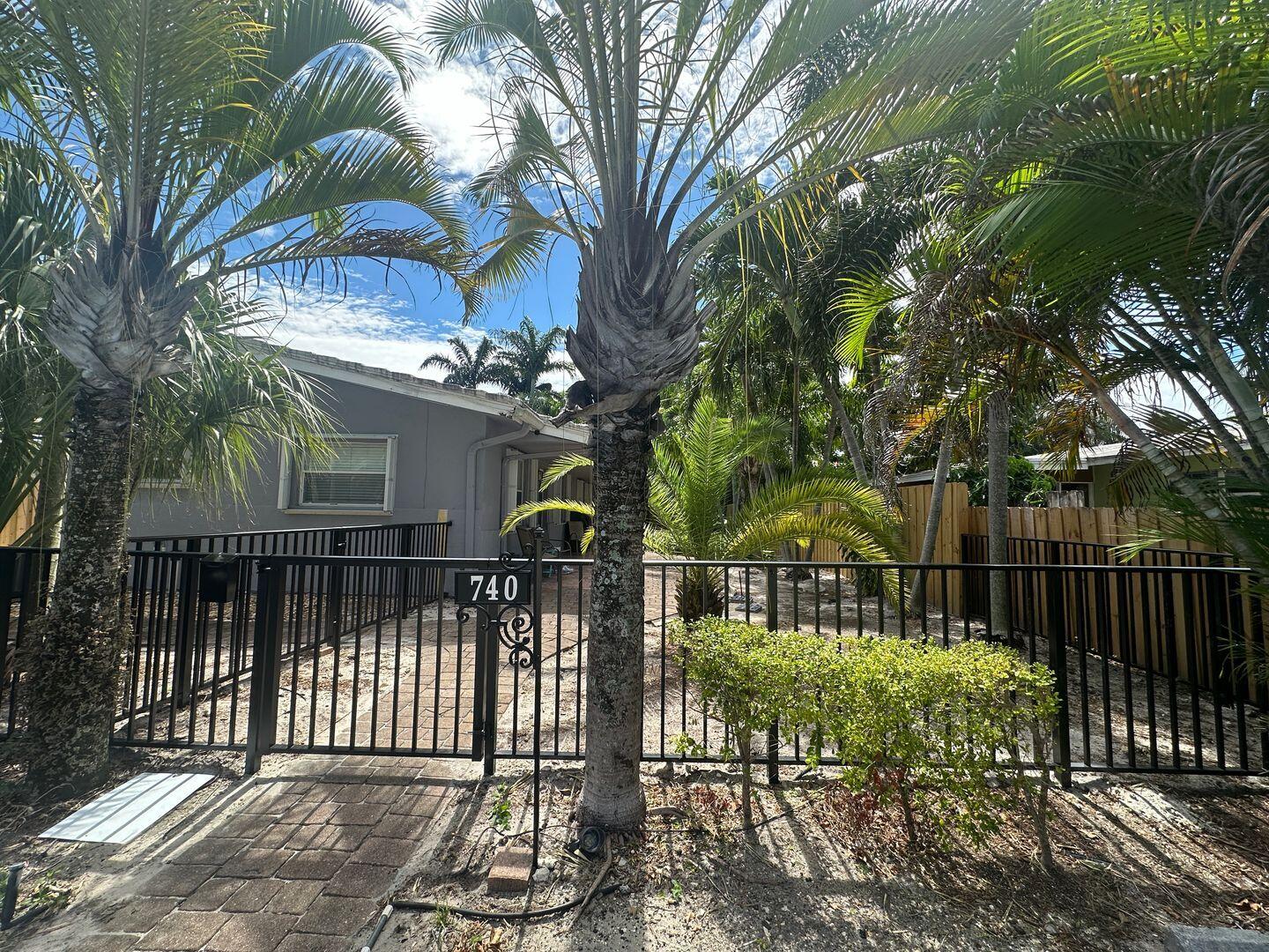 a view of a house with a small yard