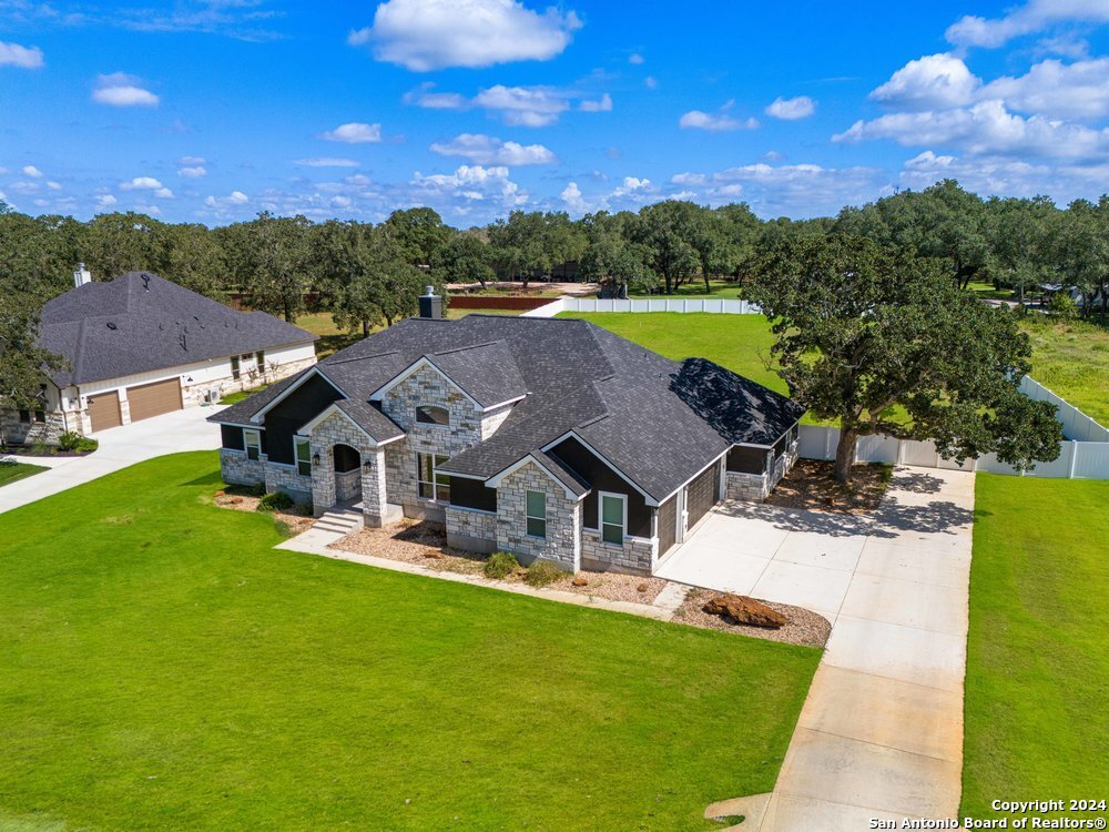 a view of a house with a big yard