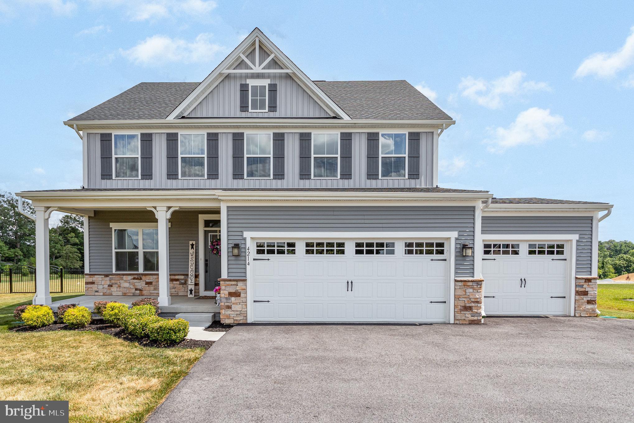 front view of a house with a yard