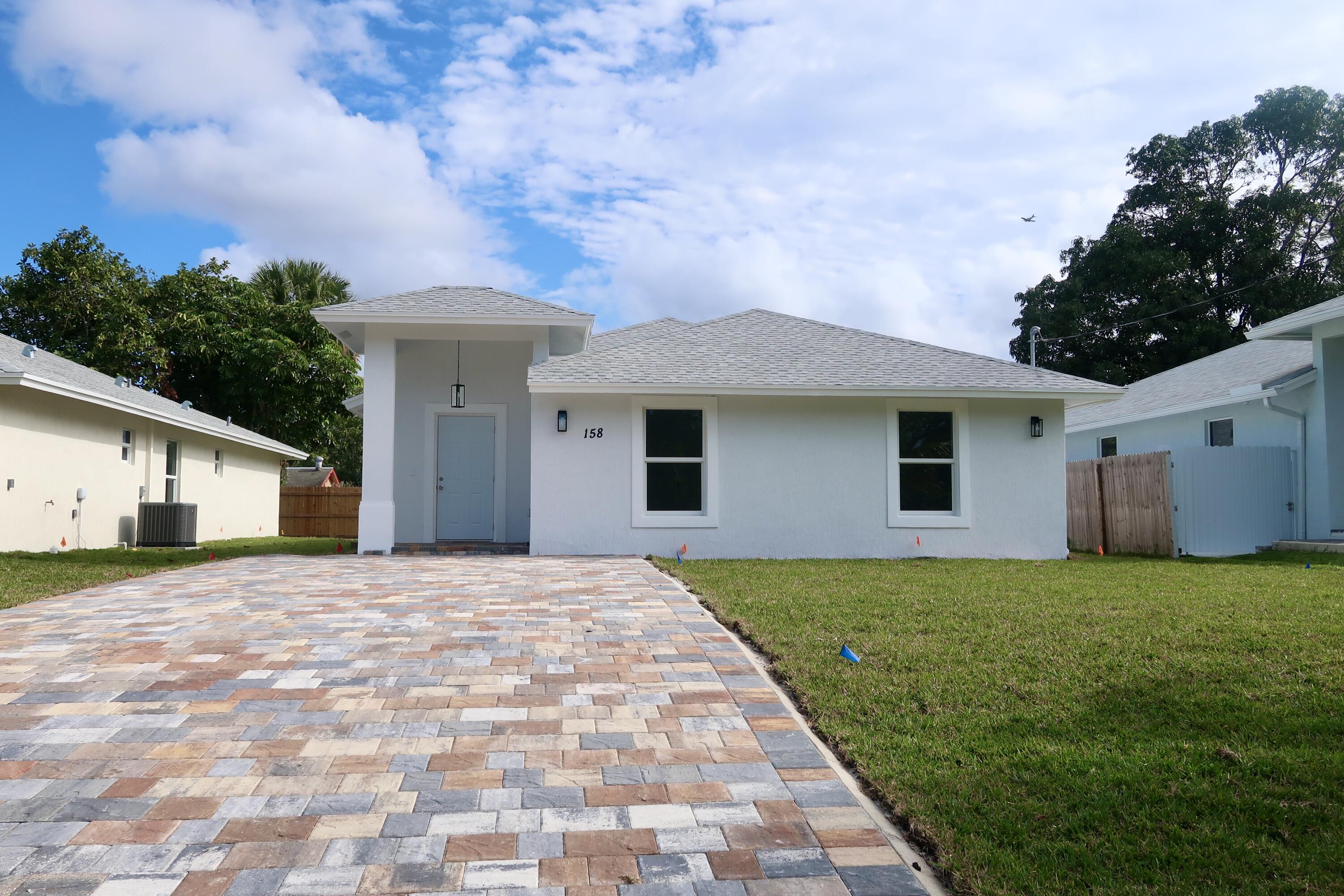 a front view of a house with yard