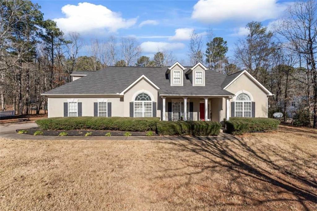 a front view of a house with a yard