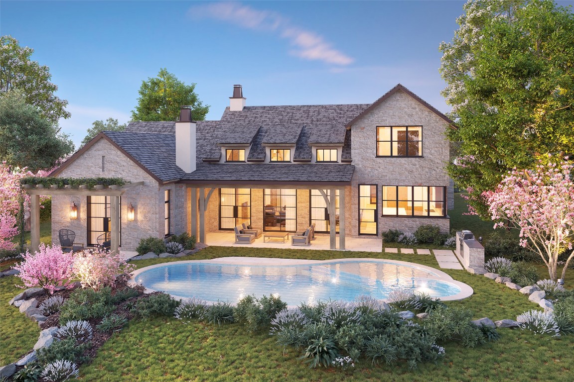 a view of a house with swimming pool and a yard