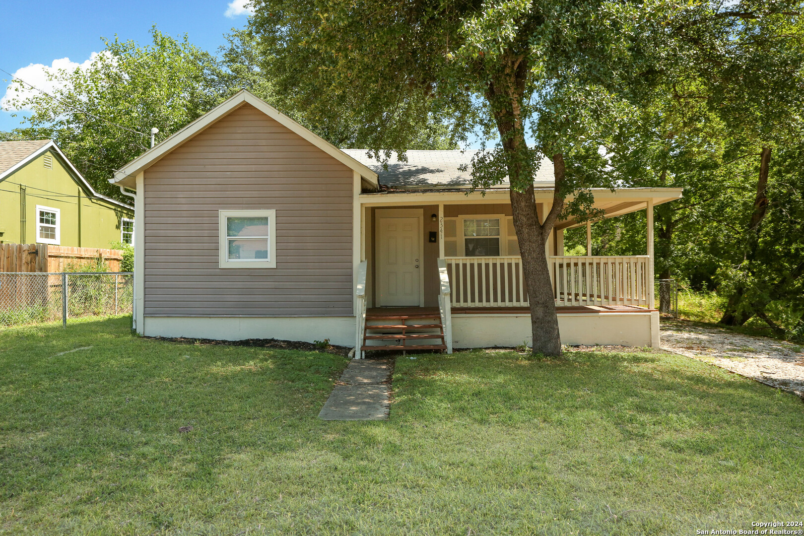 a view of a house with a yard