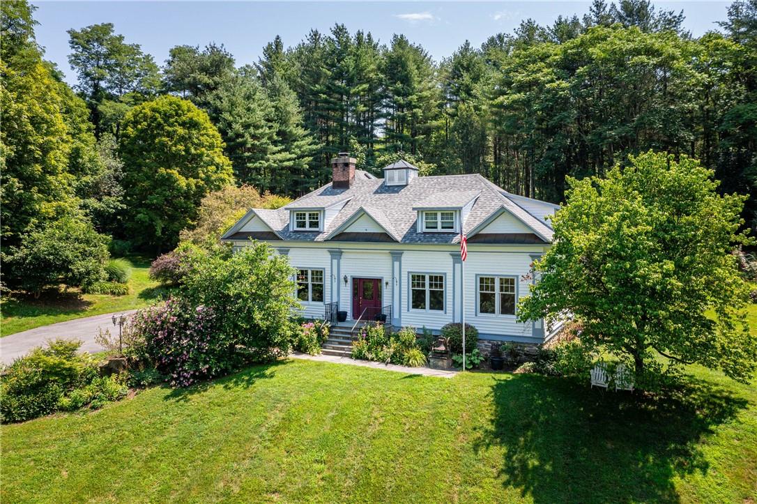 a view of a house with swimming pool and garden