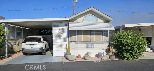 a front view of a house with parking area