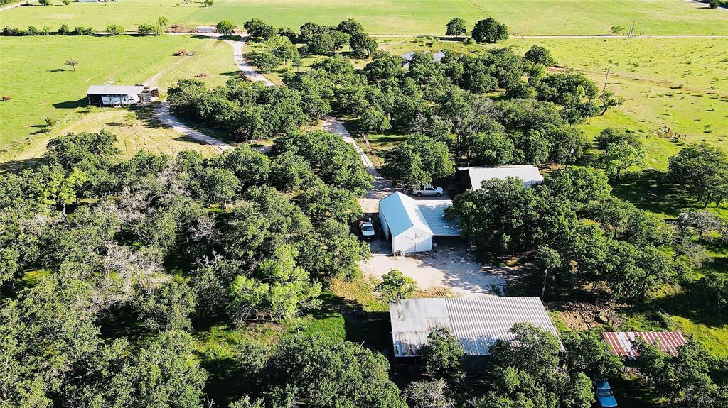 an aerial view of a house with lots of trees