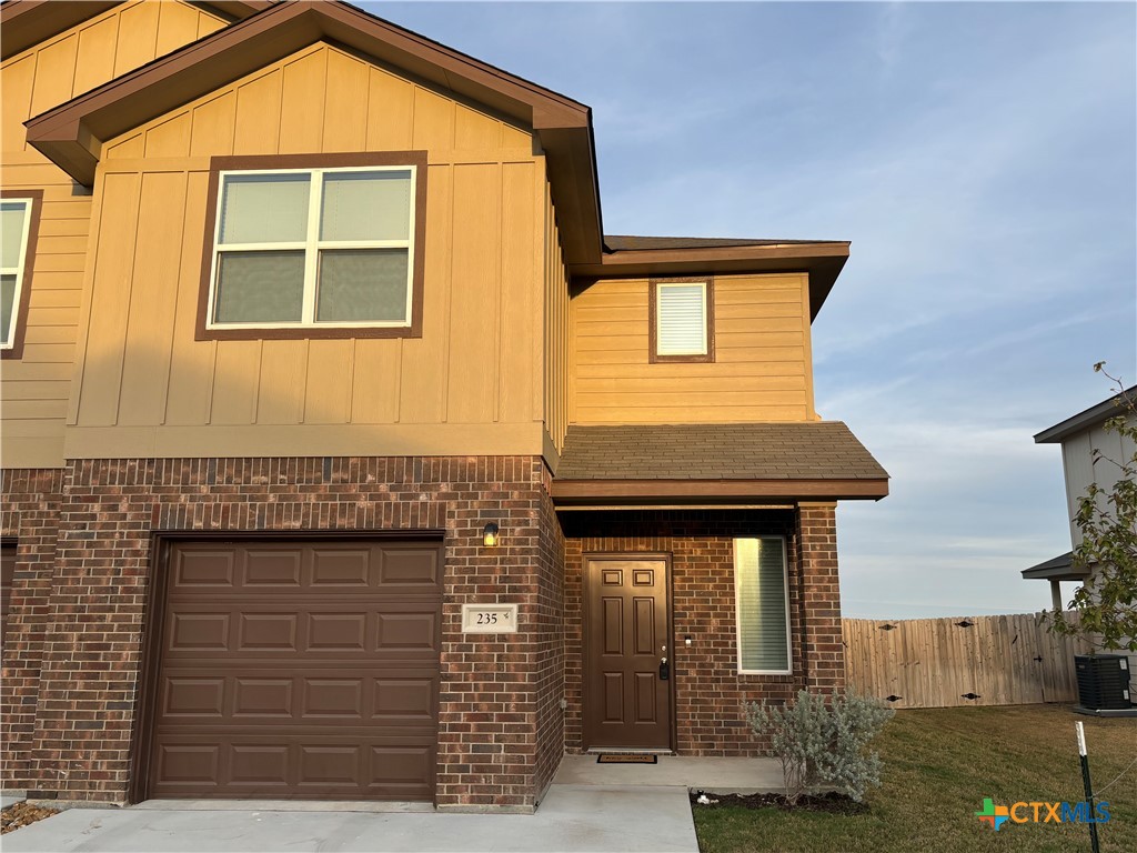 a front view of a house with garage