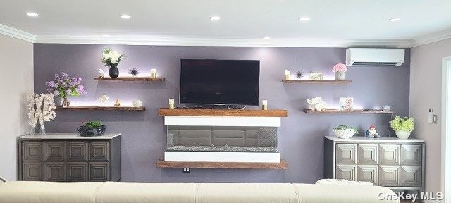 a living room with stainless steel appliances kitchen island granite countertop furniture and a fireplace