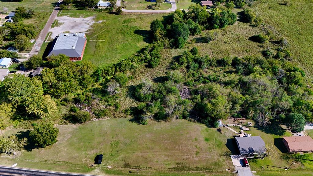 an aerial view of residential house with outdoor space and swimming pool