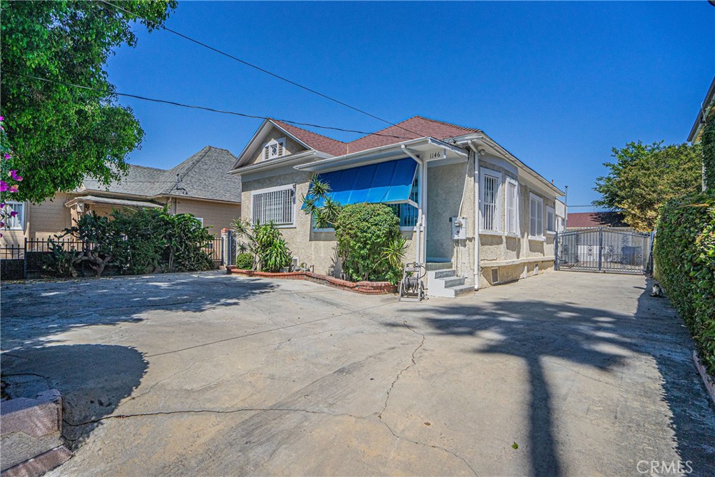 a front view of a house with a yard and a garage