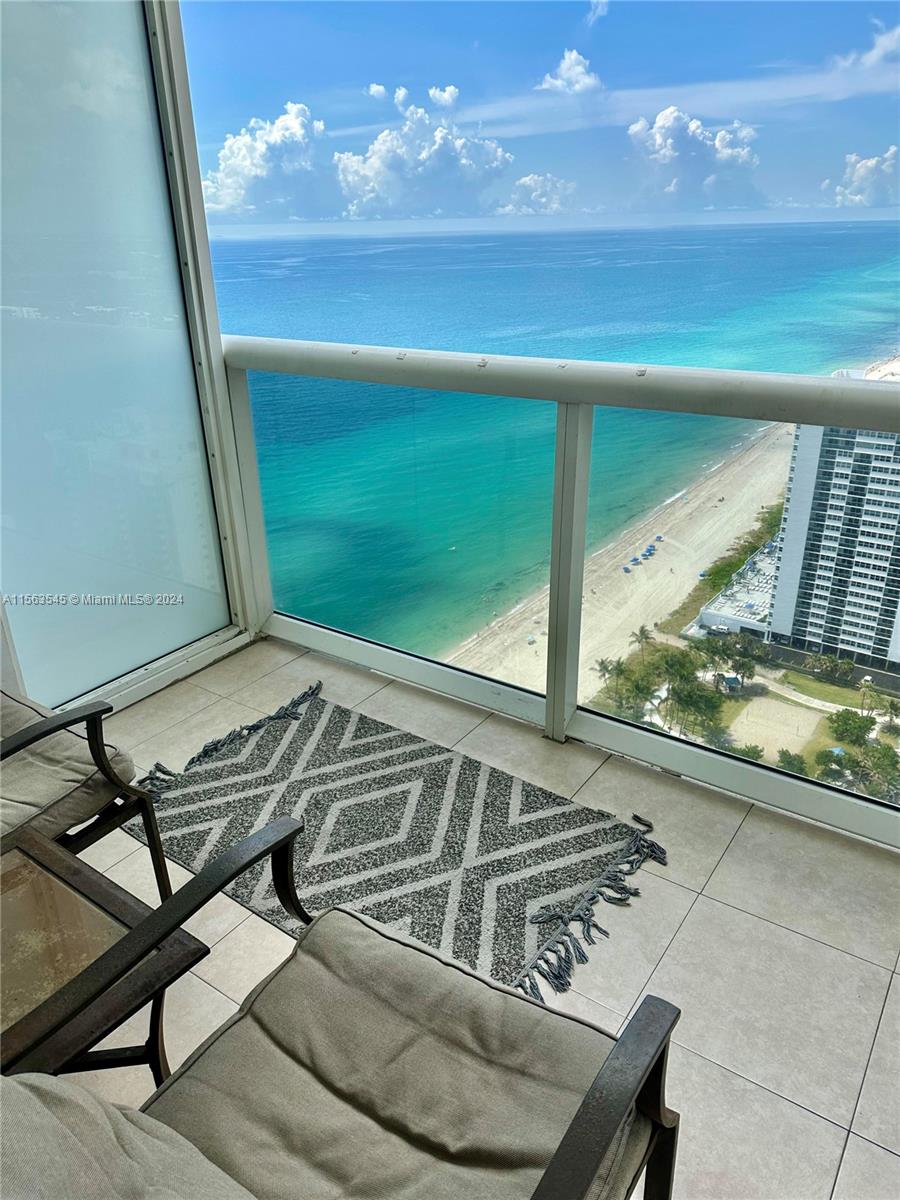 a view of a balcony with chair