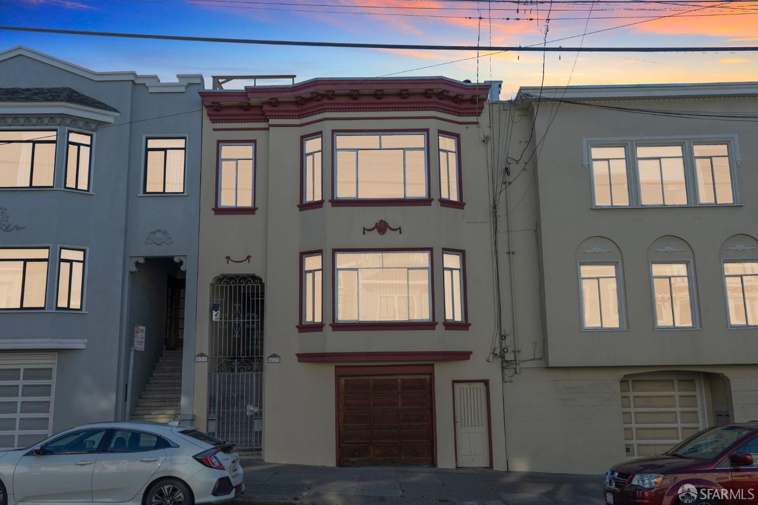 a front view of a house with parking space