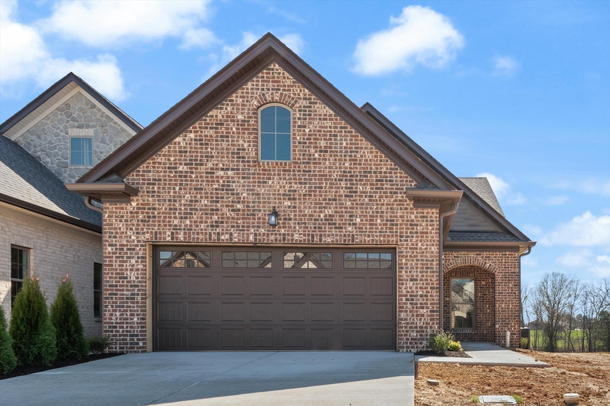 a front view of a house with garage