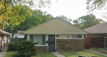 a front view of a house with garage