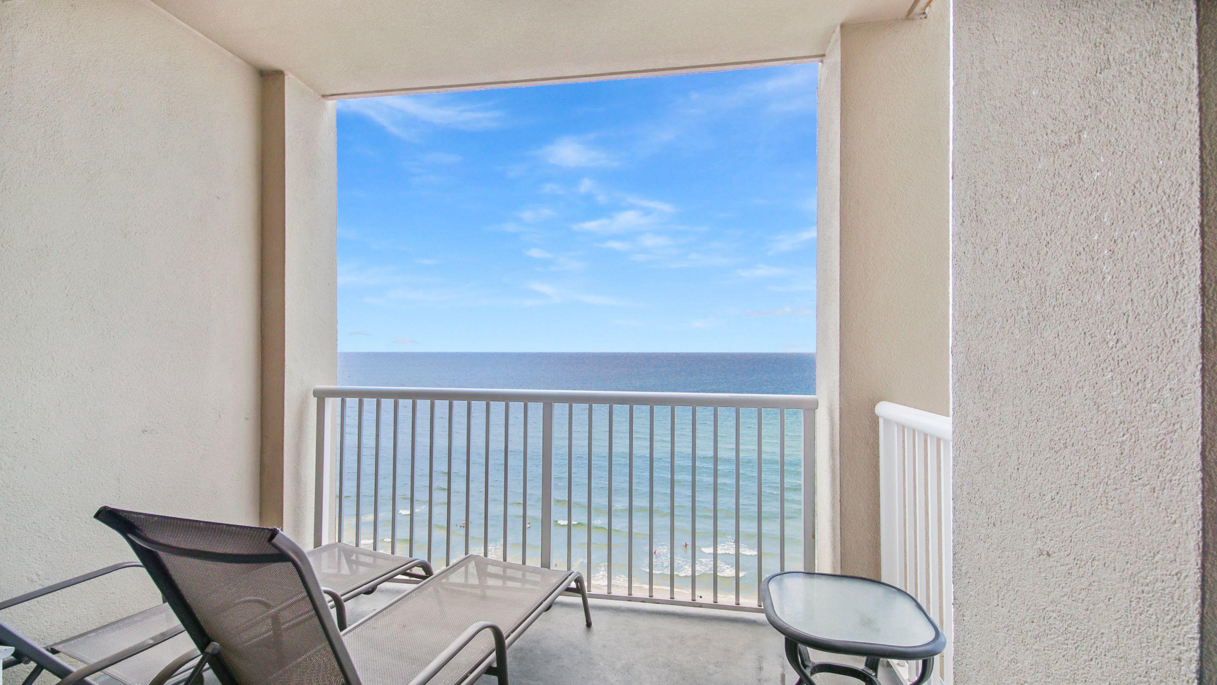 a view of a balcony with chair and wooden floor