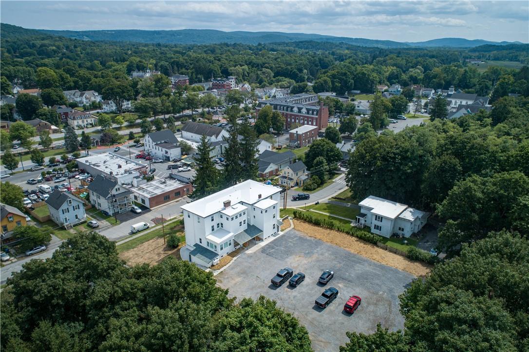 an aerial view of a house with a yard