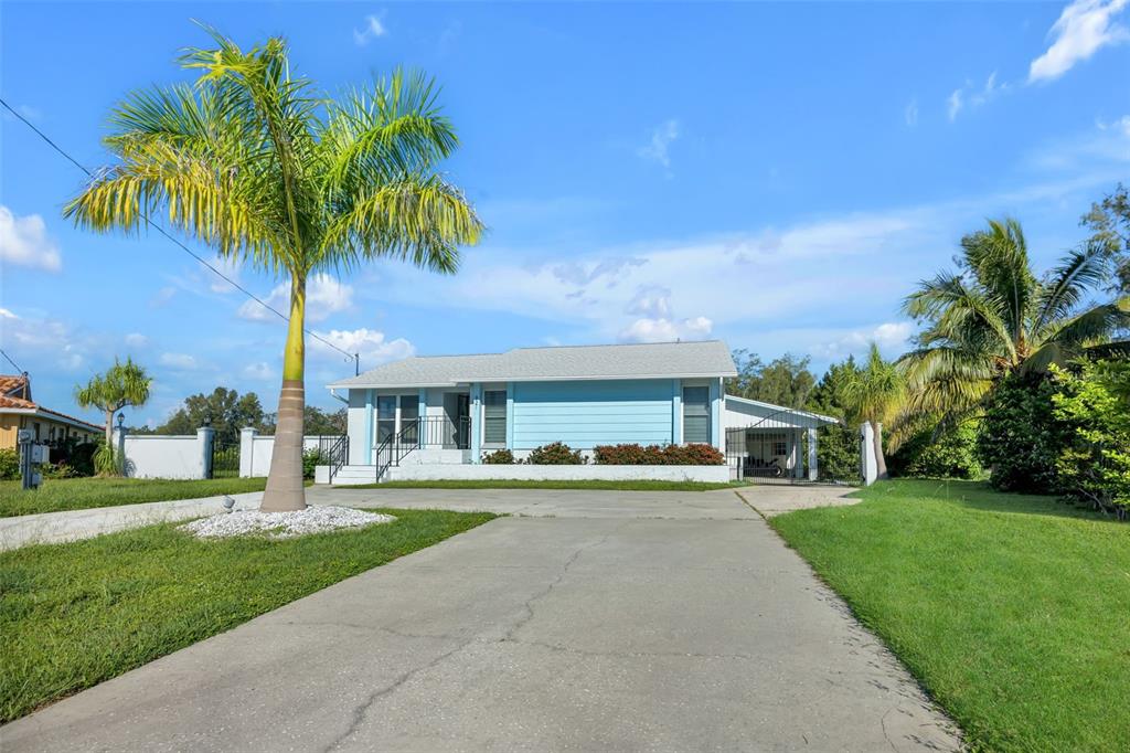 a house with palm tree in front of it