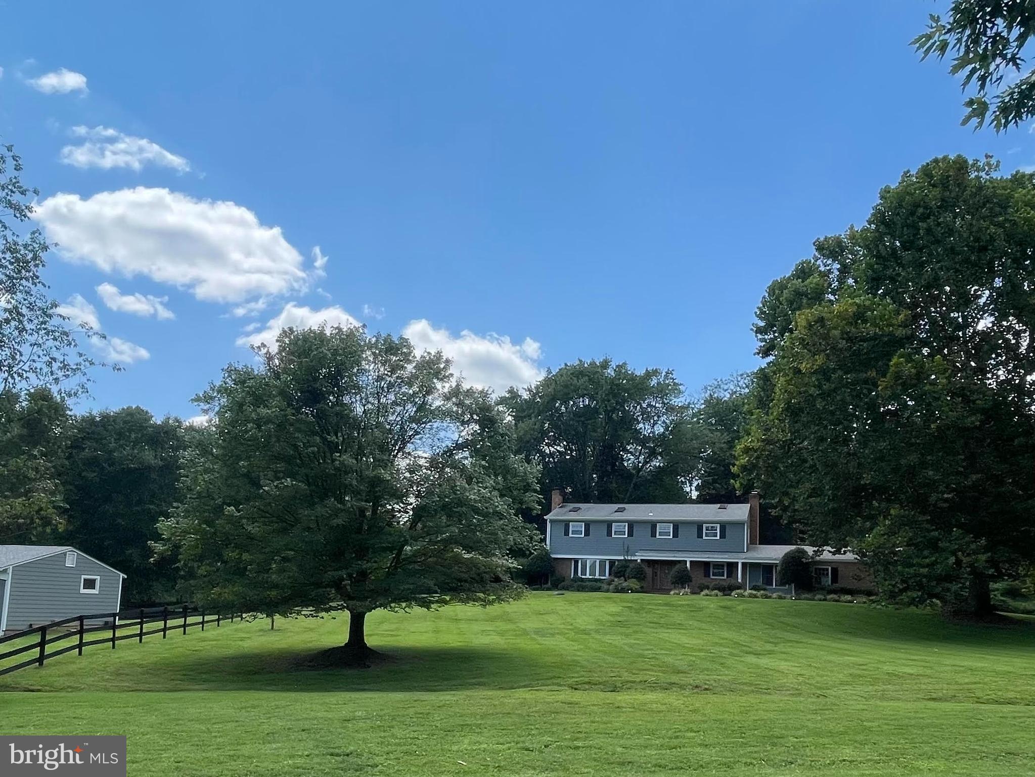 a view of a house with a big yard