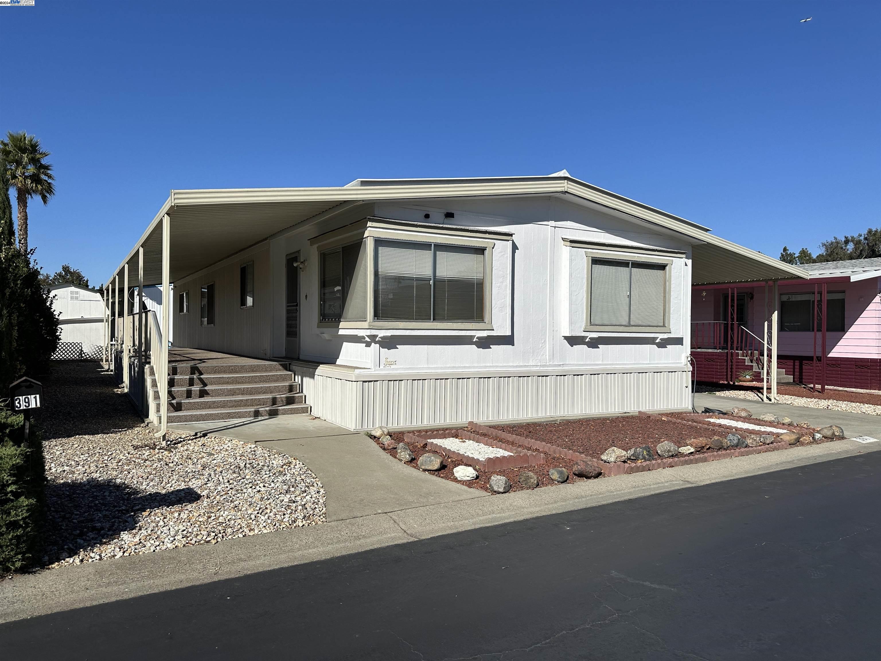 a front view of a house with a garage