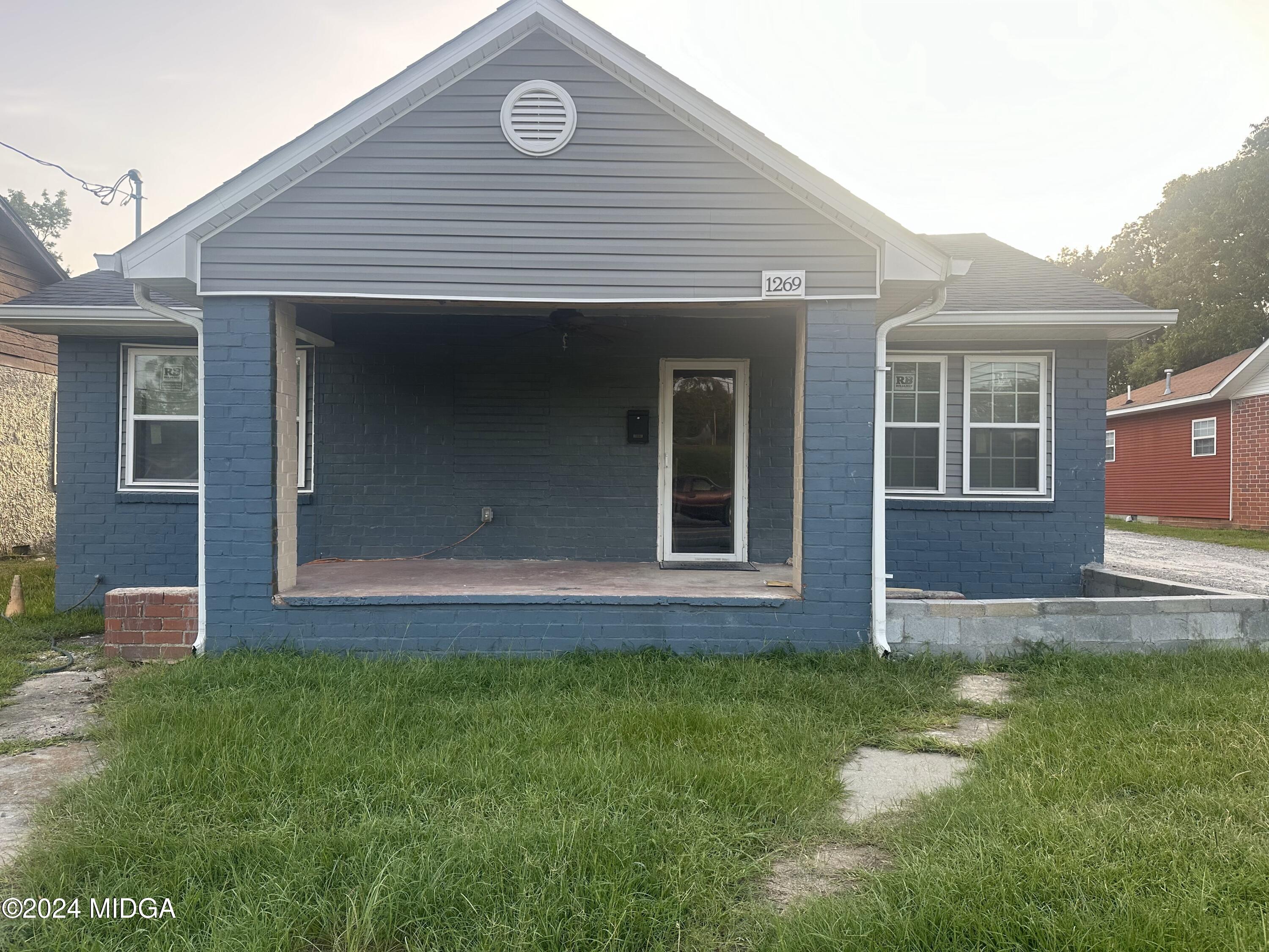 front view of a house with a yard