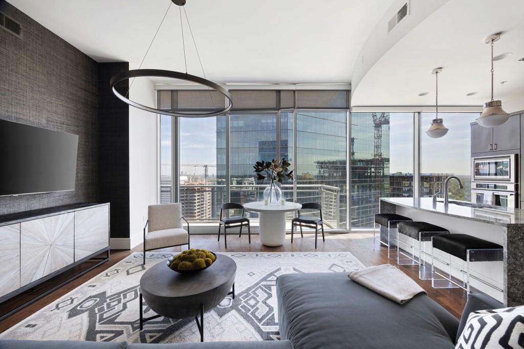 a living room with furniture and a flat screen tv