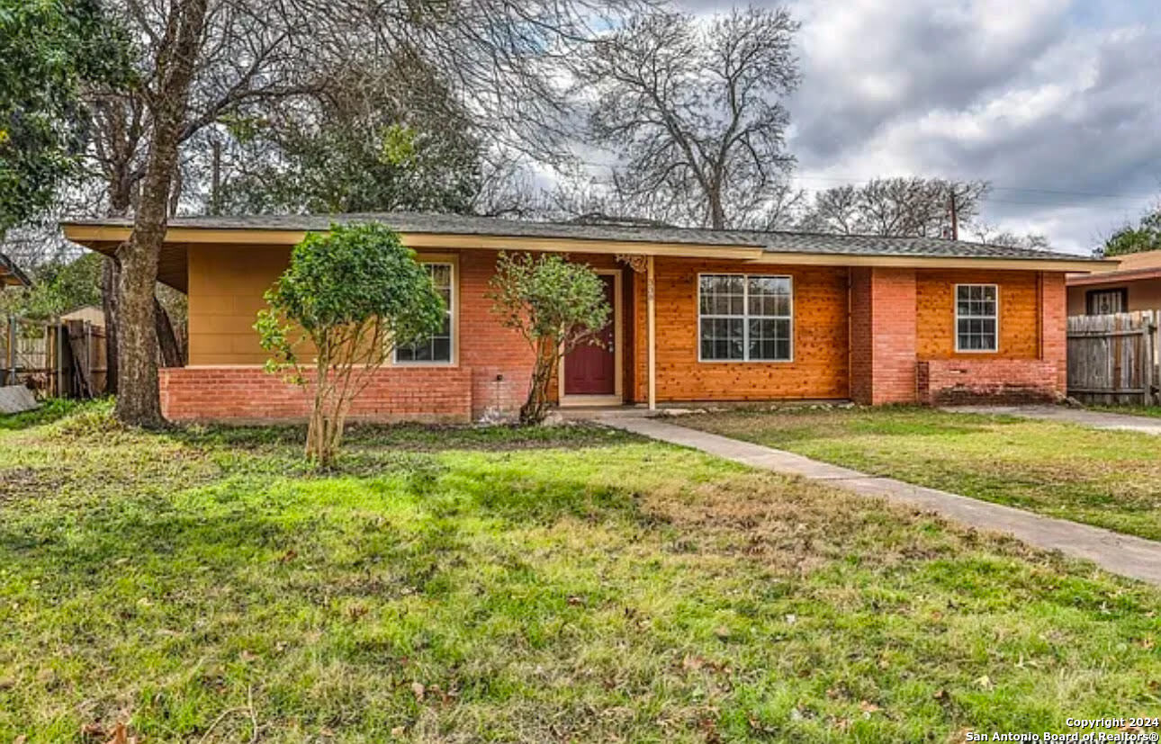 front view of a house with a yard