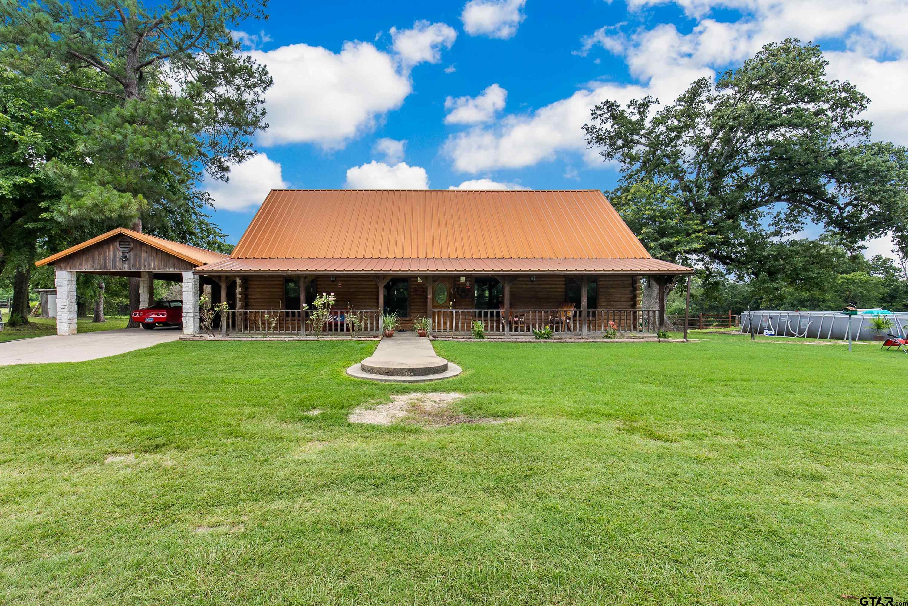 a front view of house with yard slide and outdoor seating