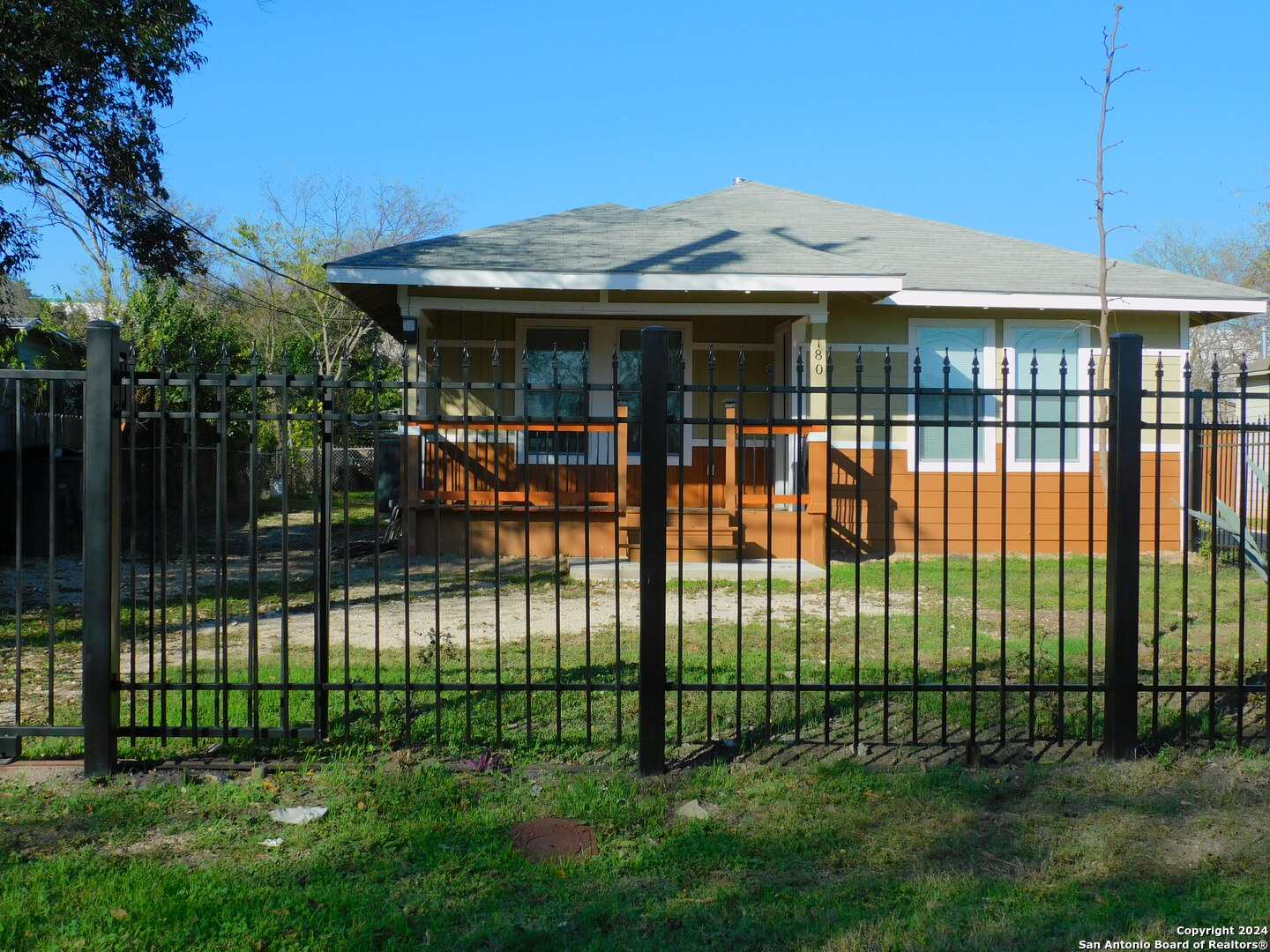 a view of a house with a deck and a garden