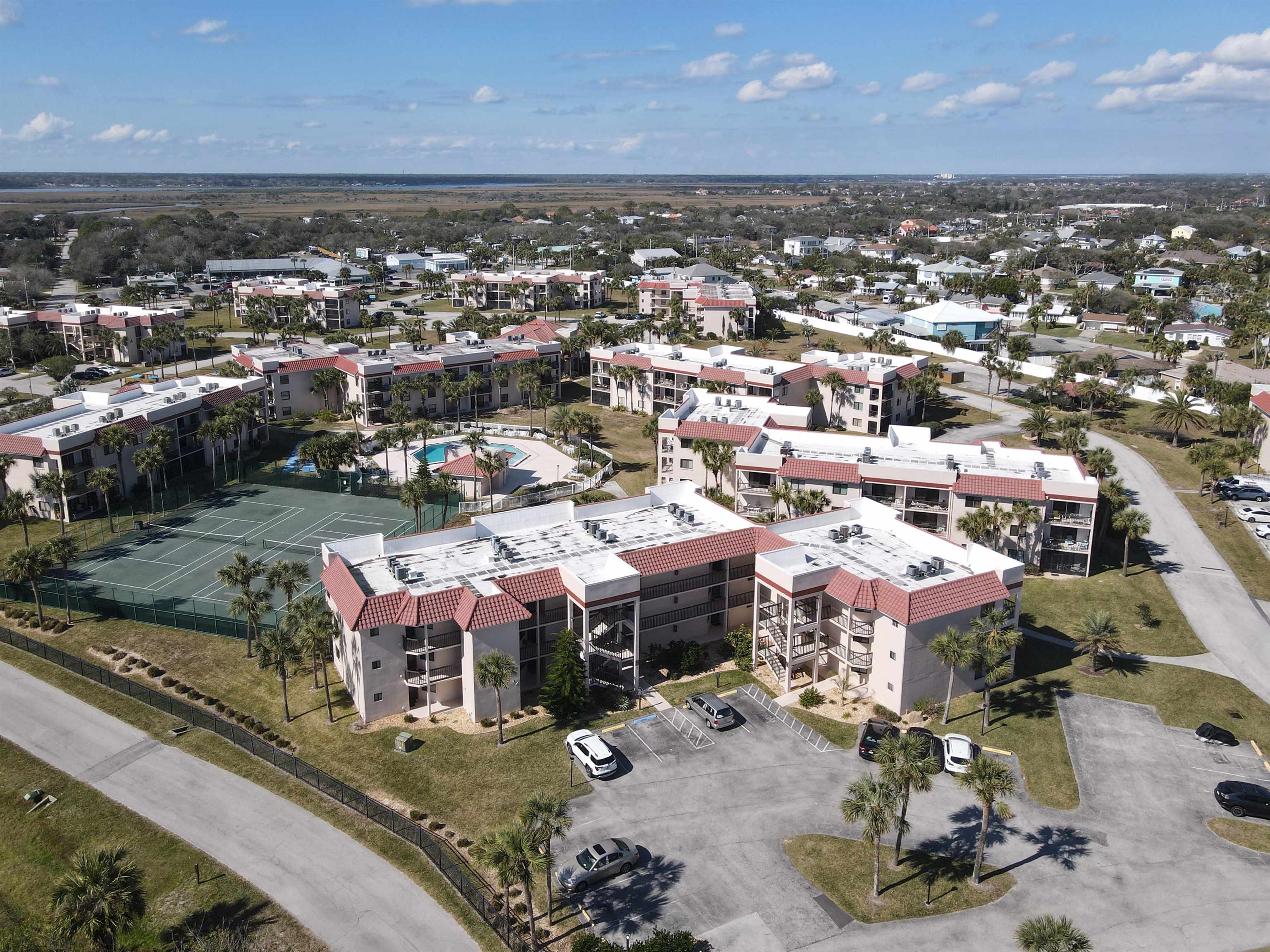 an aerial view of a houses with a yard