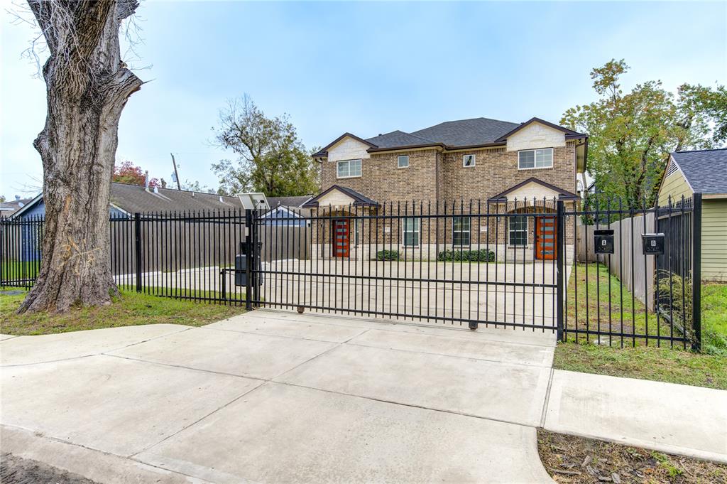 a view of a wrought iron fences in front of house