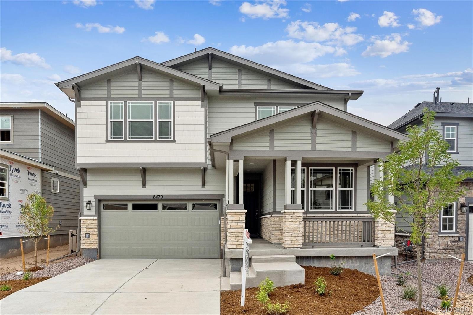 a front view of a house with a garage