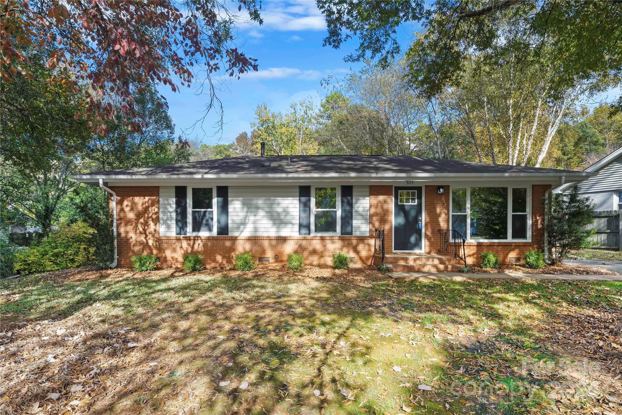 a front view of house with yard outdoor seating and green space