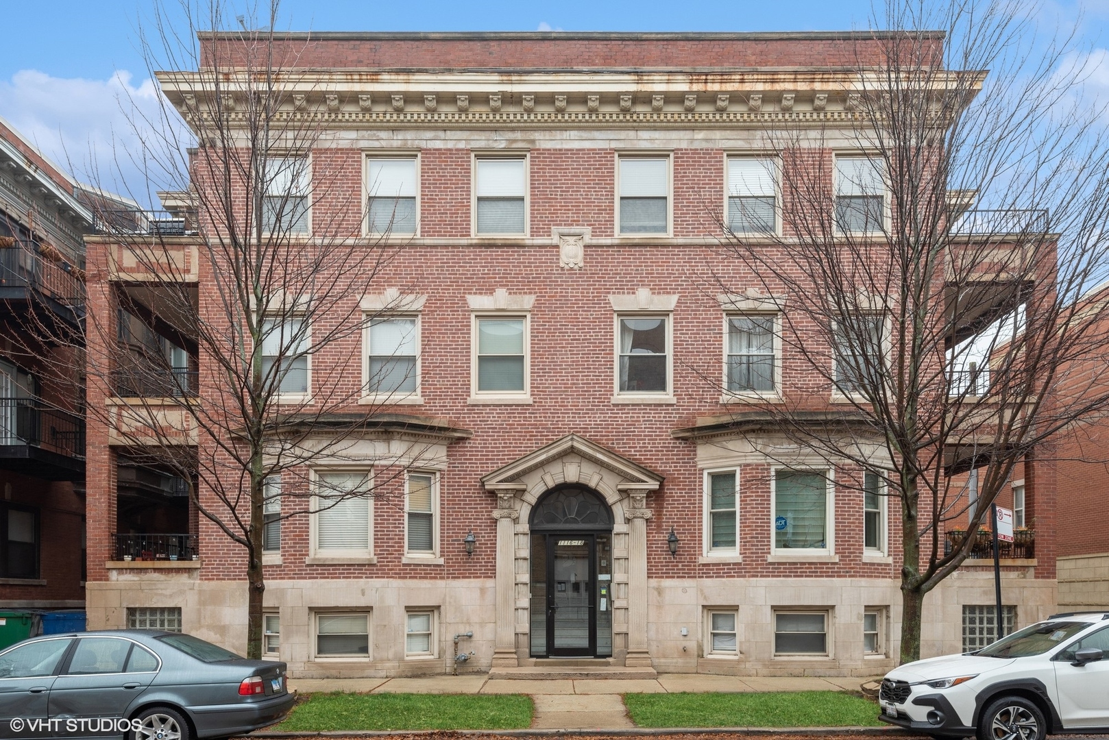 a front view of a building with a yard