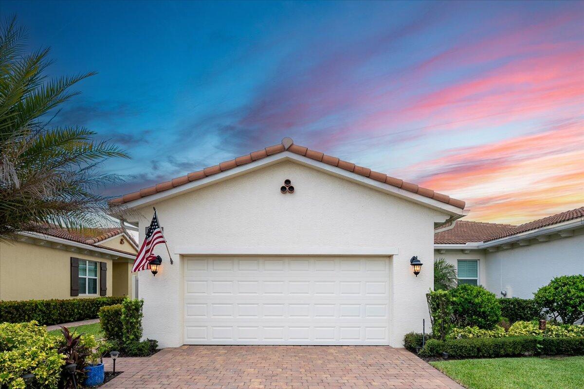 a front view of a house with yard