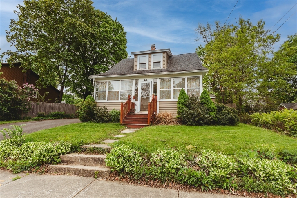 front view of a house with a yard