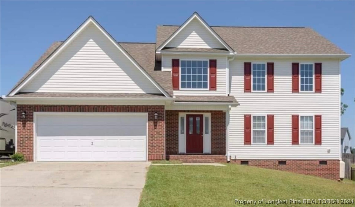 front view of a house with a yard