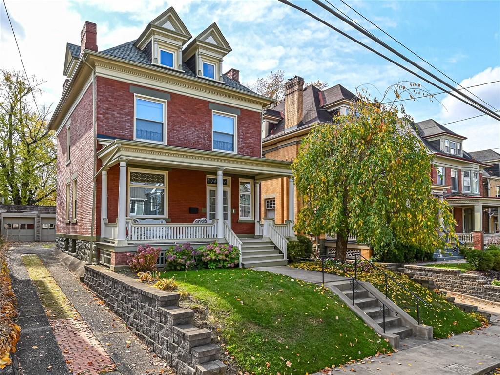 a front view of a house with garden