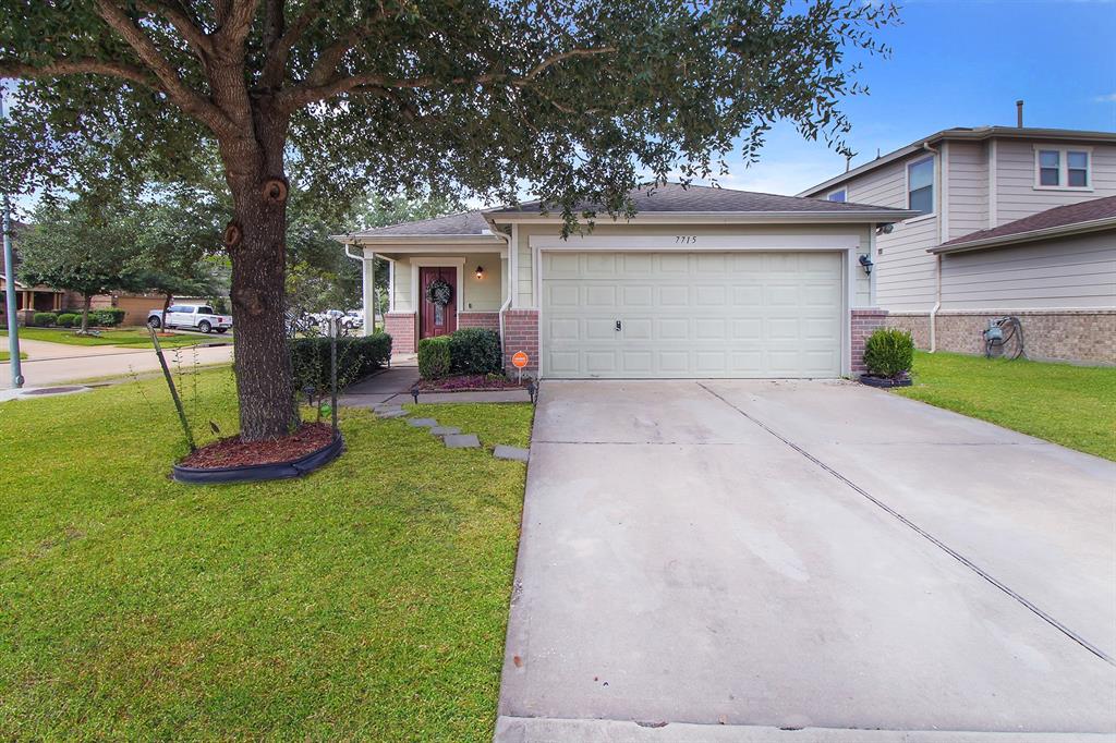 Welcome home to 7715 Sagemark Ridge Drive! Your new rental home is perched on a corner lot beneath a mature shade tree in Canyon Village at Cypress Springs.