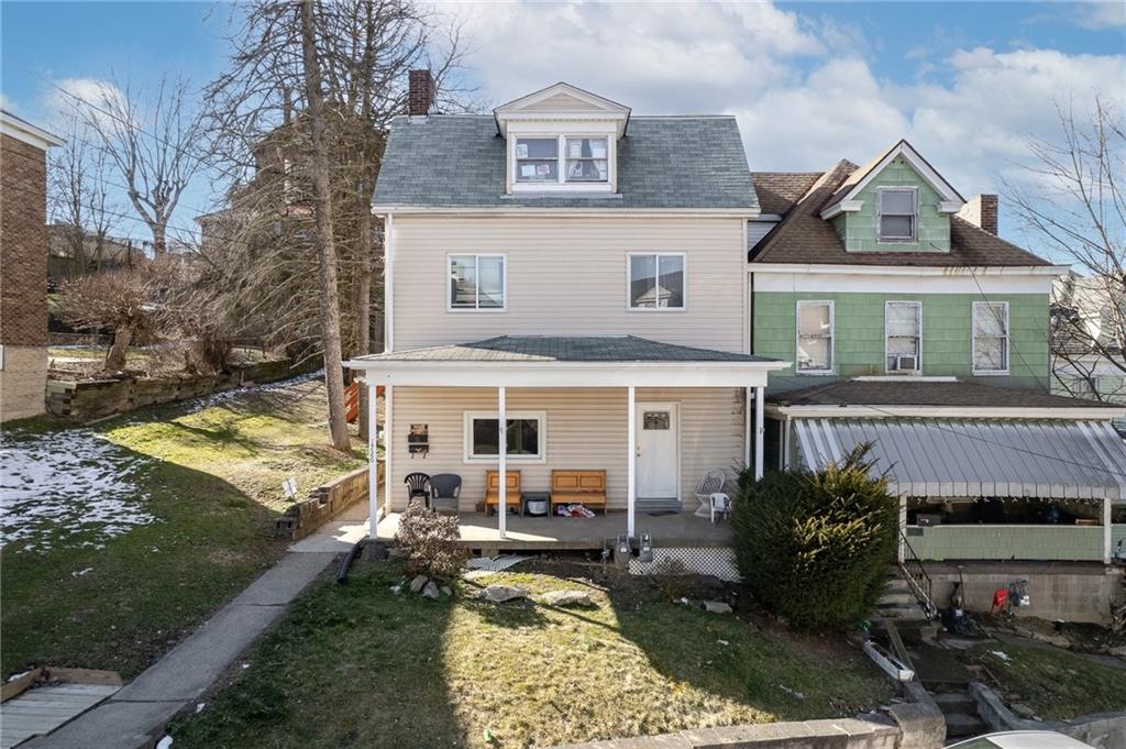 front view of a house with a yard