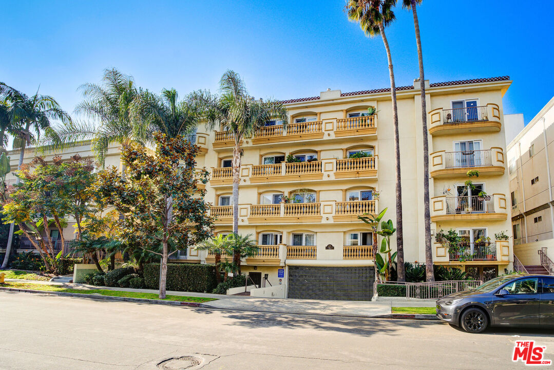 a front view of a building with street view