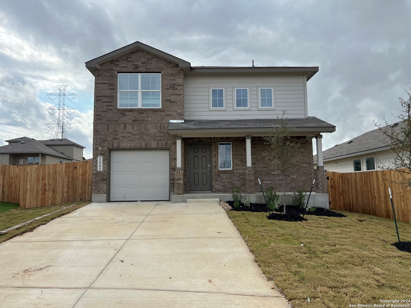 a front view of a house with garage