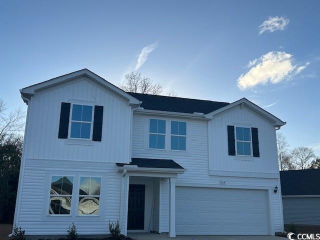 Front of property featuring a garage