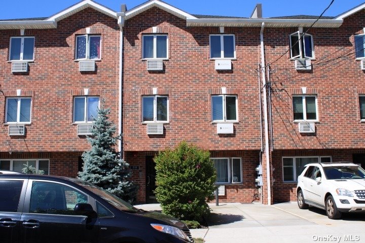 a front view of a house with parking space