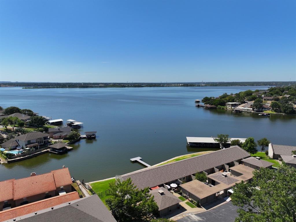 an aerial view of a house with a lake view