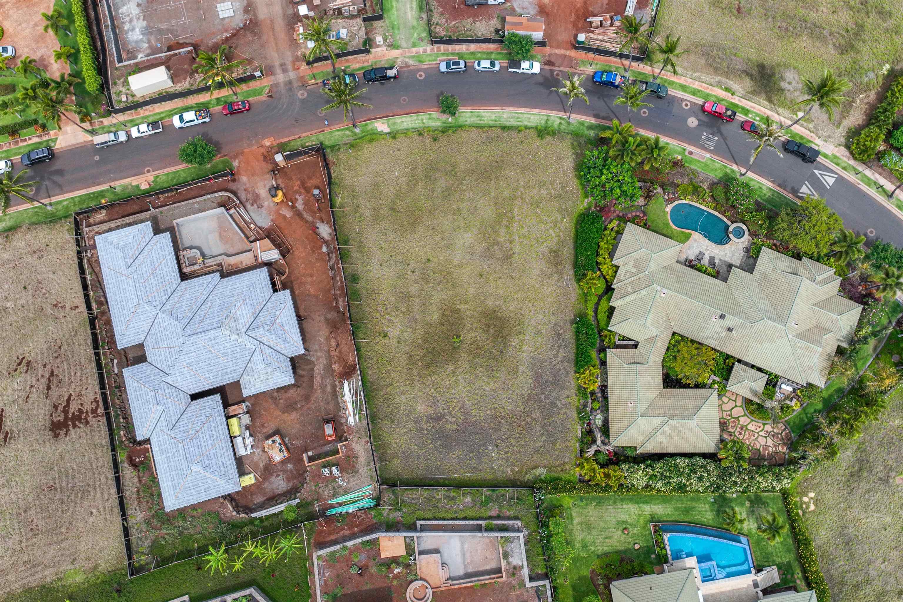 an aerial view of residential house with outdoor space and parking