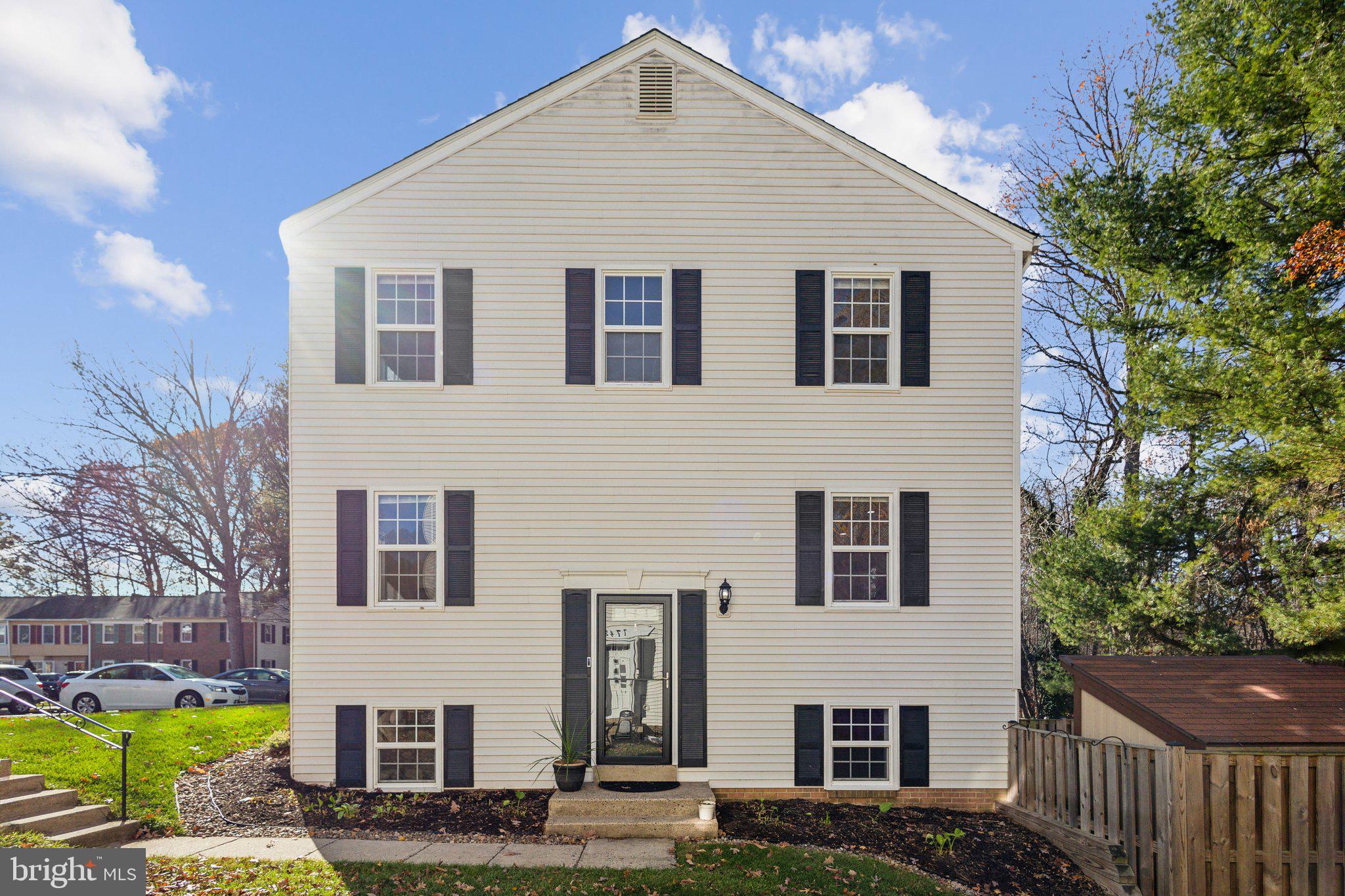 a view of house that has a yard