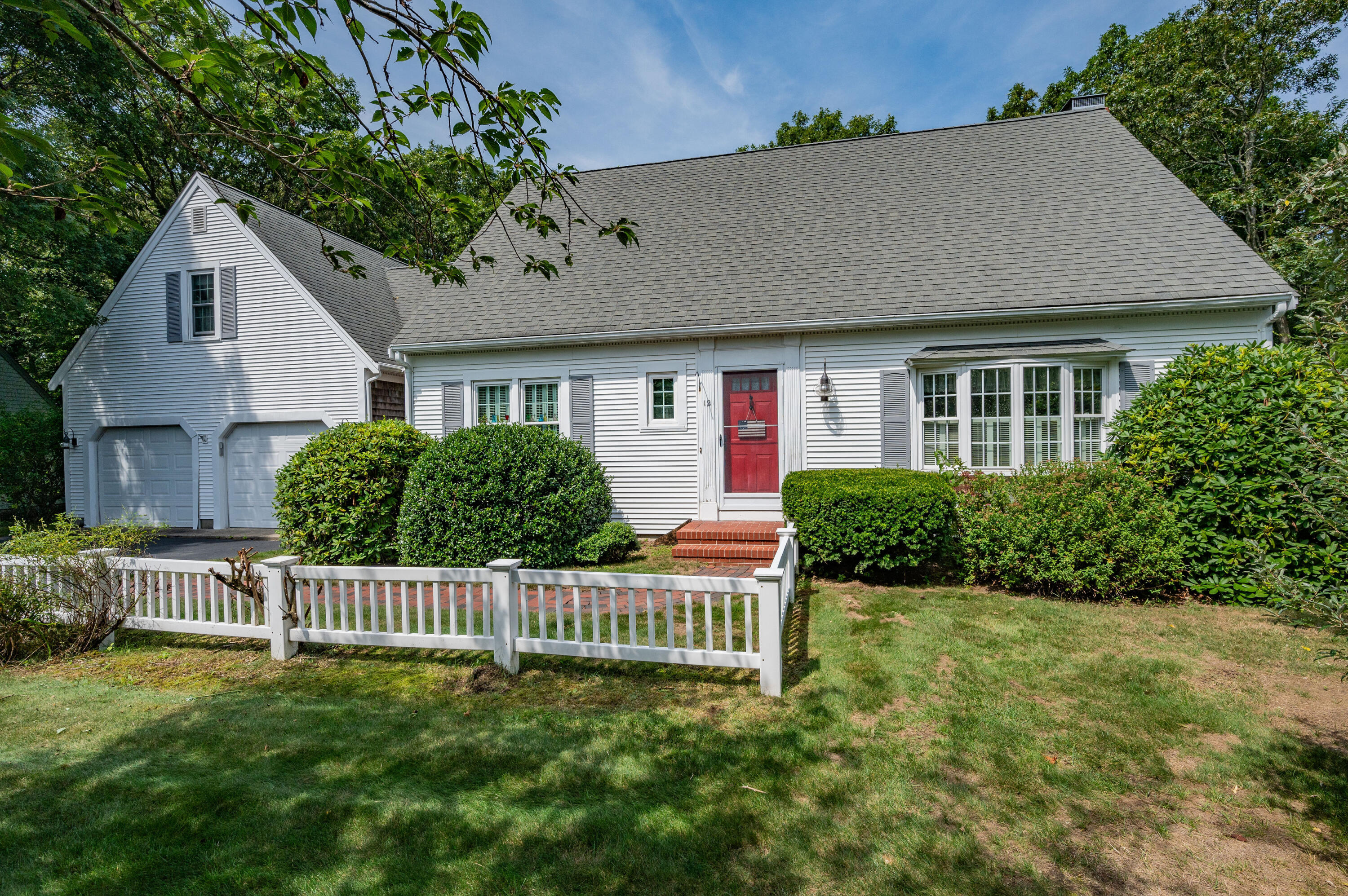 a view of a house with a yard and garden