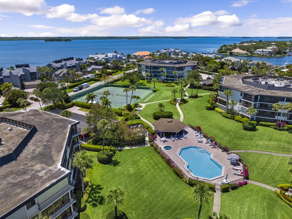 a aerial view of a house with a swimming pool yard and outdoor seating