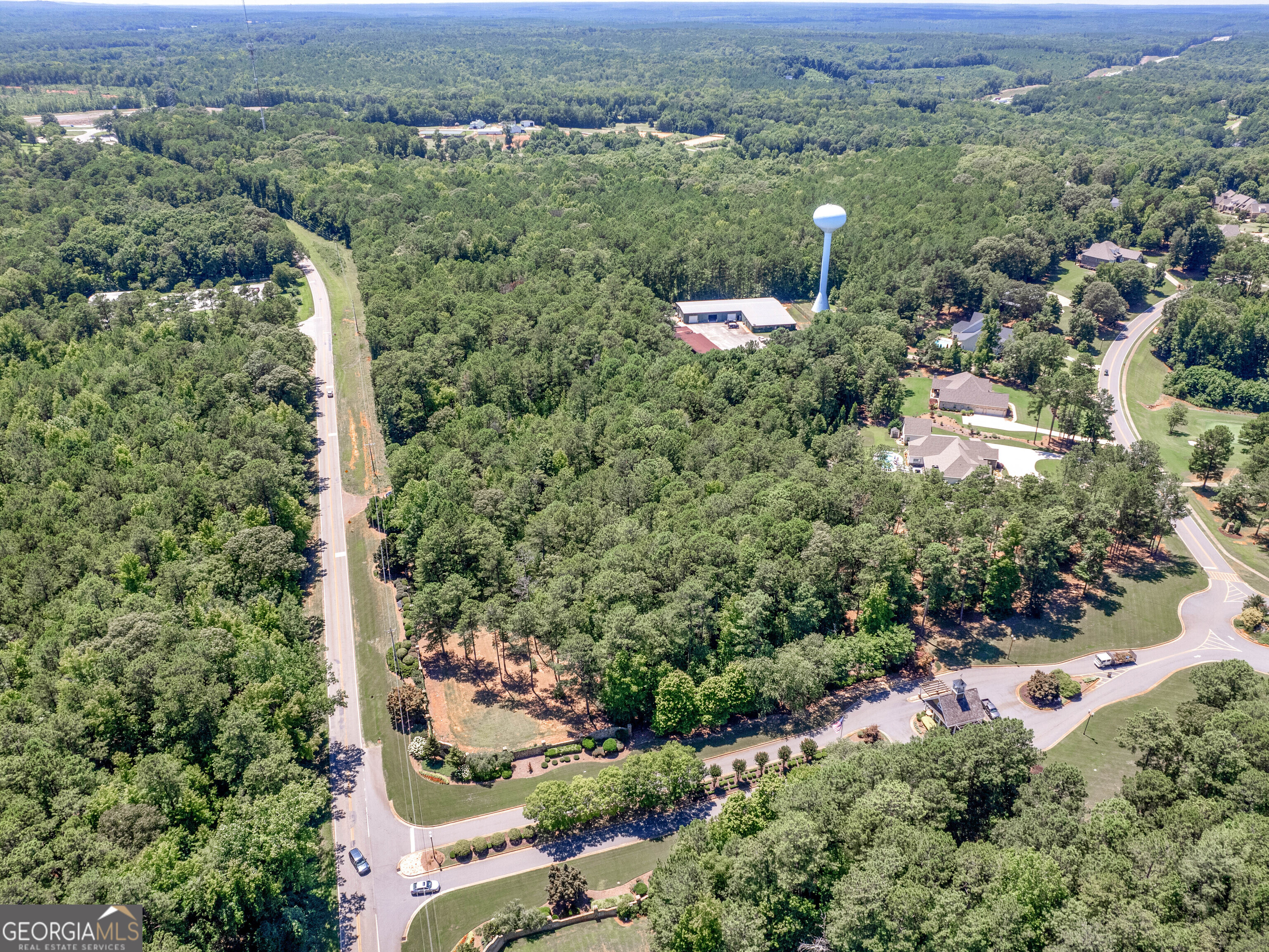 an aerial view of a house with outdoor space