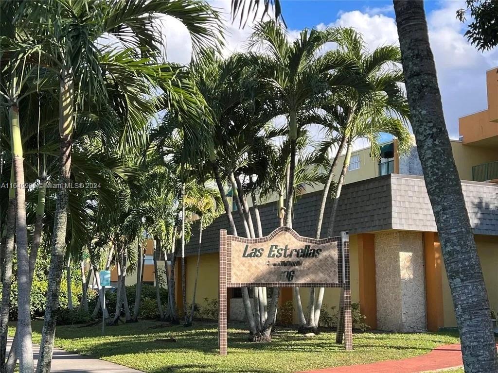 a view of a palm trees in a yard